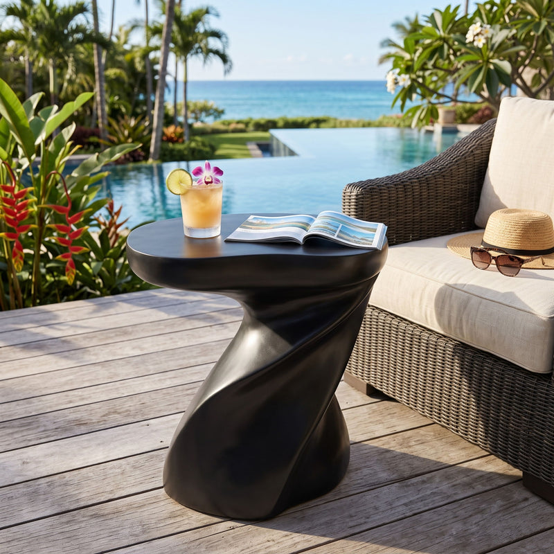 Twisted sculptural side table with round top and black sculpted base