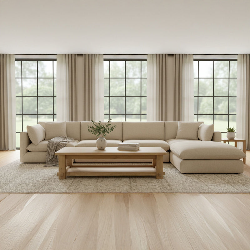 Natural wood coffee table with open shelf and wide top in a living room