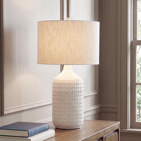 Ceramic table lamp with linen beige shade and white speckled textured base