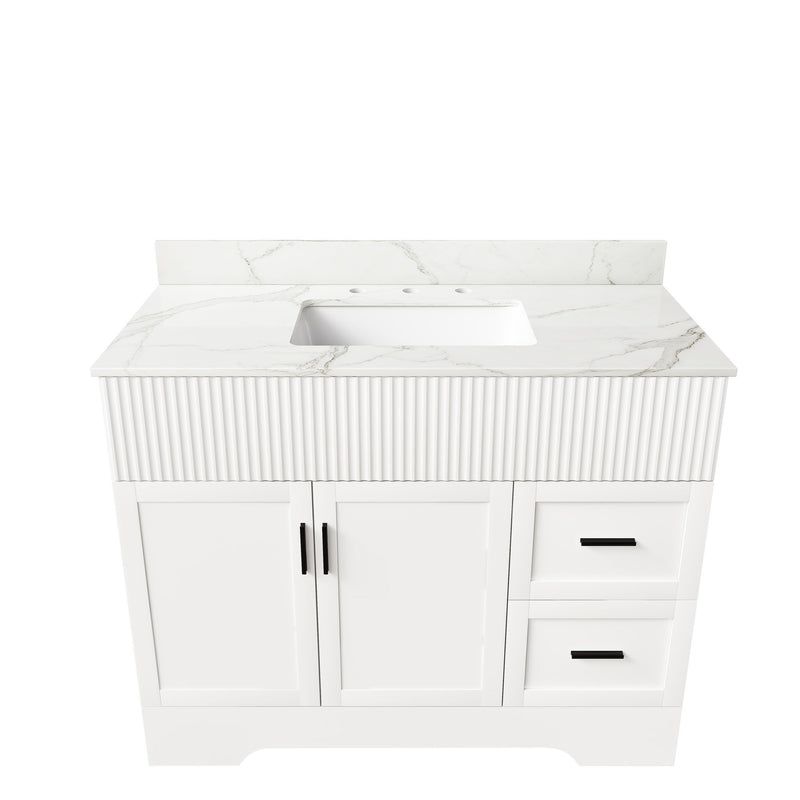 White bathroom vanity set with fluted cabinet, sink top, two doors, two drawers.
