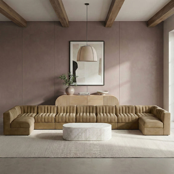 Light brown armless velvet modular sectional with tufted back cushions and chaise corner pieces
