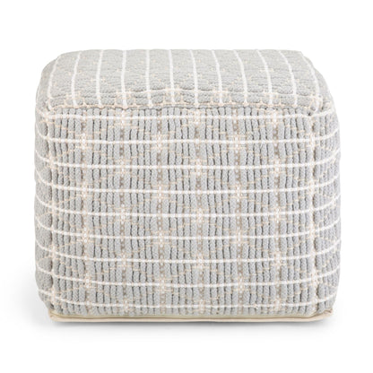 Upholstered square pouf in light gray textured fabric with white grid stitching.