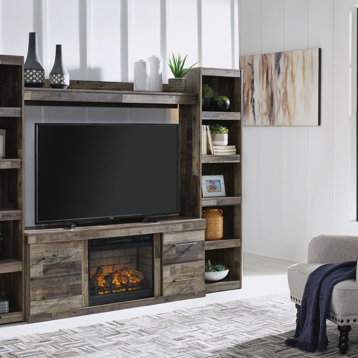 Dark gray entertainment center with TV space, electric fireplace, and open shelves