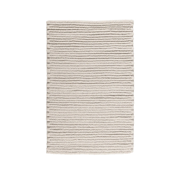 Dawson rug folded view in light cream with horizontal ribbed texture and neat edges
