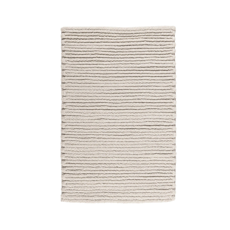 Dawson rug folded view in light cream with horizontal ribbed texture and neat edges