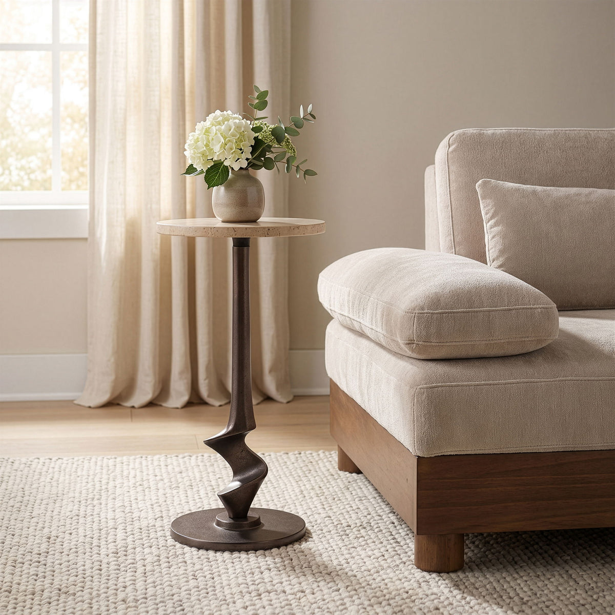 Dark metal aluminum side table with round top and sculpted pedestal base