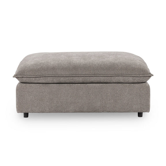 Upholstered ottoman in medium gray fabric, rounded top, short legs and seams