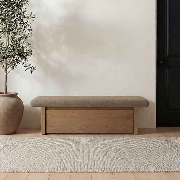 Taupe upholstered storage bench with padded top and front wooden storage door