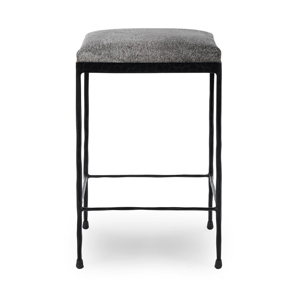 Gray counter stool with upholstered top and black metal frame