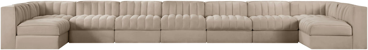 Beige armless velvet modular sectional with tufted back cushions and rounded arm sections