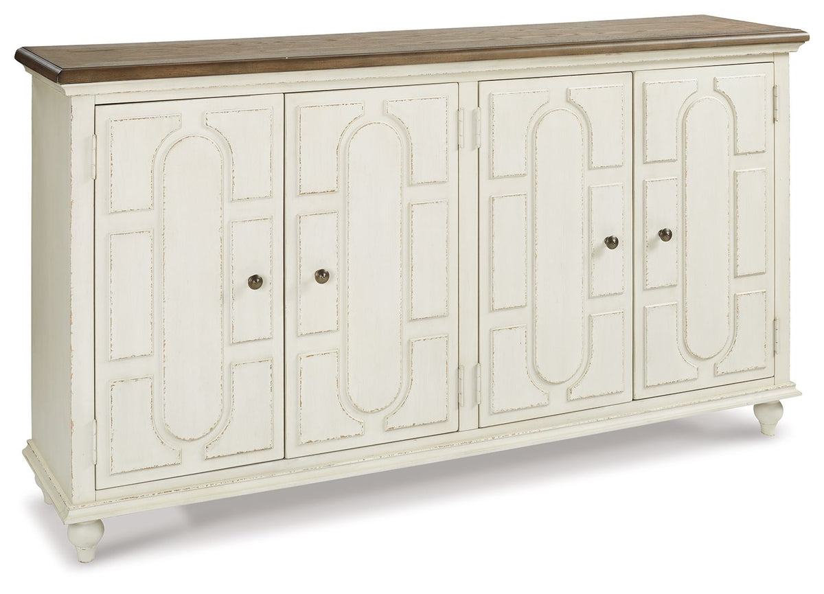 Antique white accent cabinet with carved doors and four dark knobs, long top