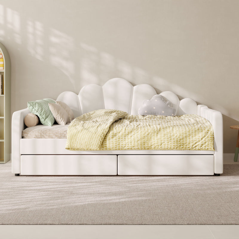 White upholstered daybed frame with scalloped back detail and built-in mattress support