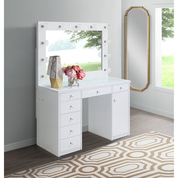 White vanity desk with mirror framed by round lightbulbs and multiple drawers