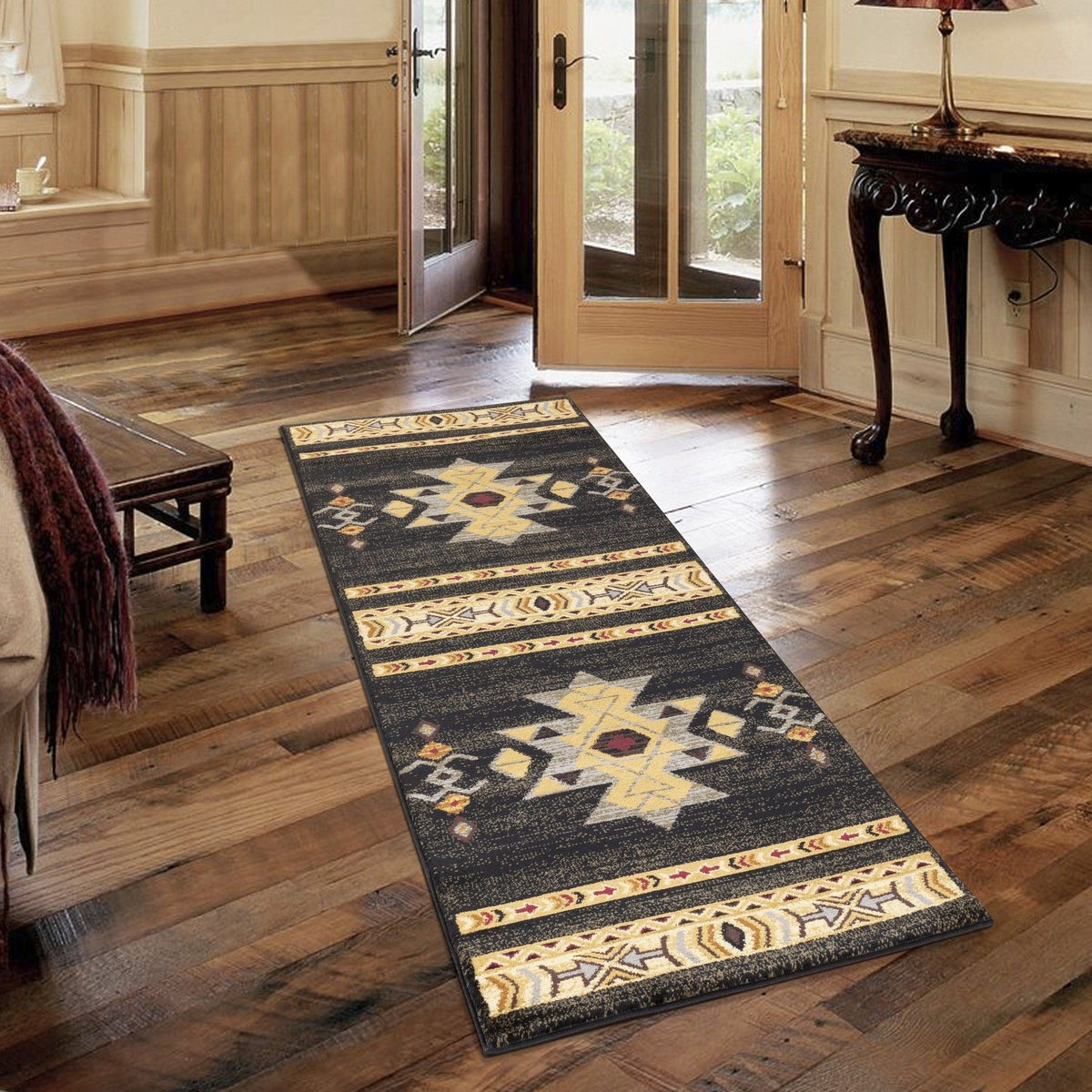 Narrow runner southwest area rug in dark colors with star and diamond motifs