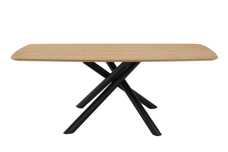 Light wood dining table with rounded edge and black crossed legs, close side view