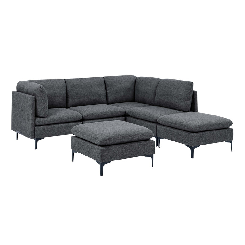 Dark gray upholstered sectional sofa with tall legs and matching ottoman in front