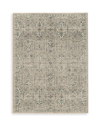 Beige rectangular rug with distressed ornamental tile-style pattern