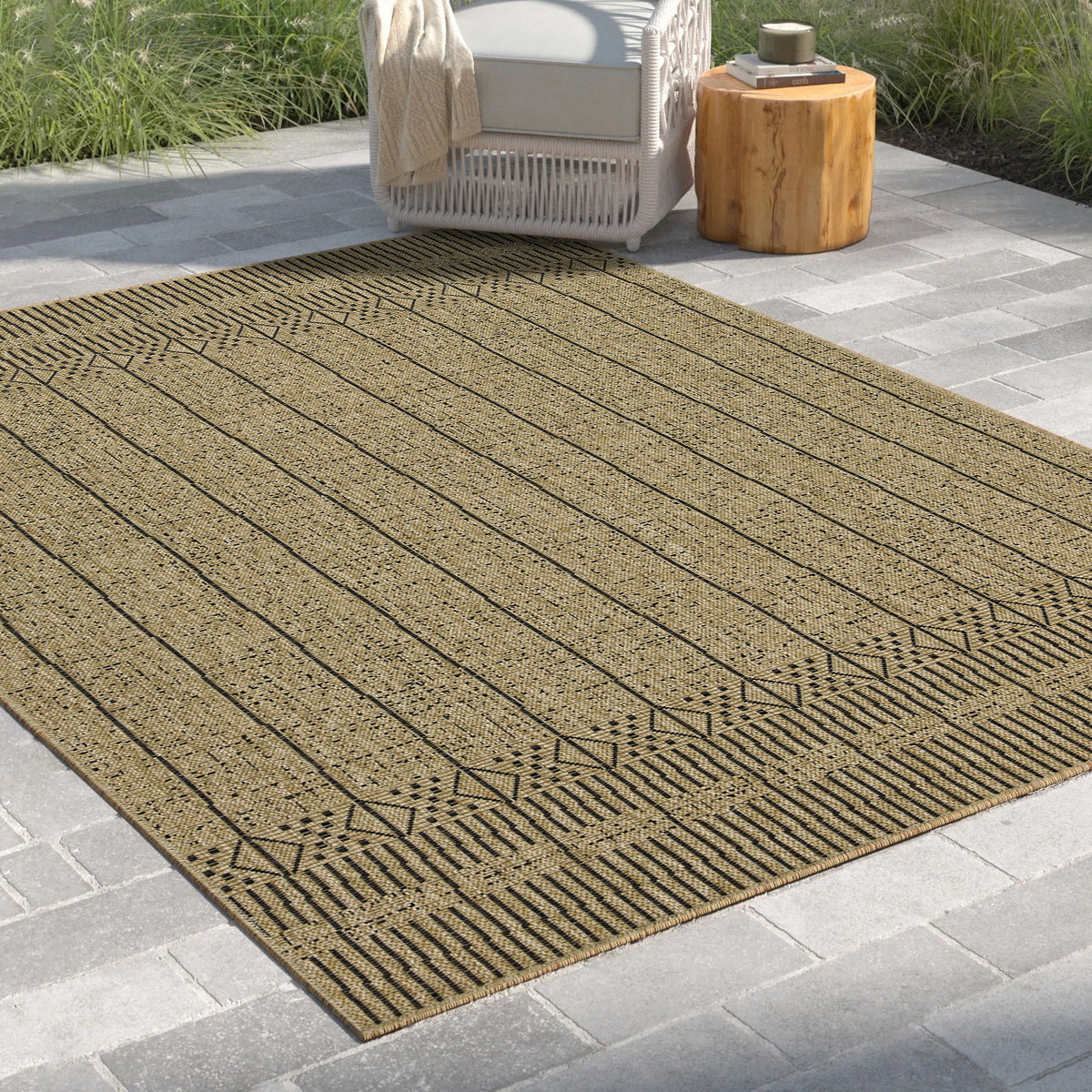 Light brown jute area rug angled view with ribbed stripes and geometric border