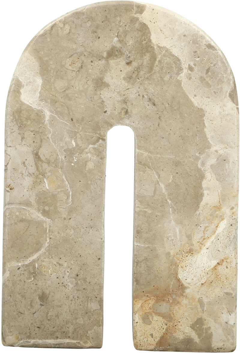 Cream marble bookend with arched cutout, speckled stone texture