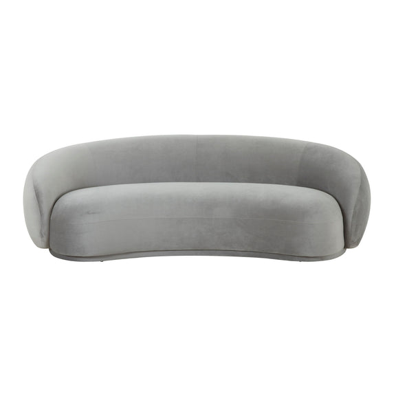 Gray velvet sofa with rounded back and low, curved silhouette