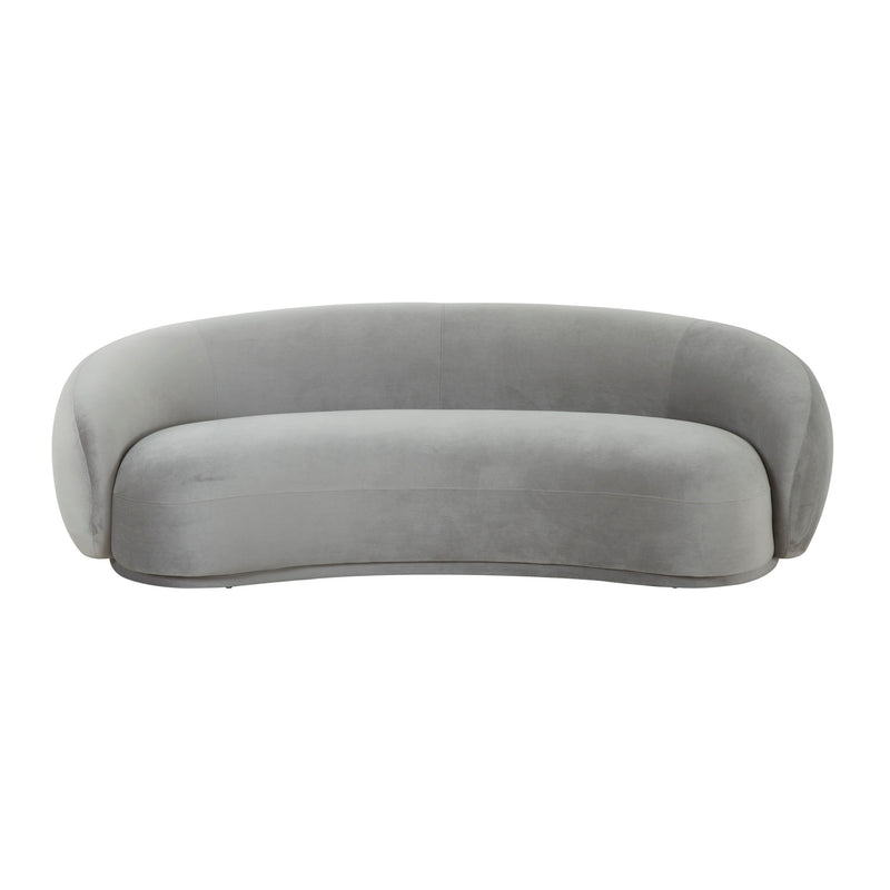 Gray velvet sofa with rounded back and low, curved silhouette