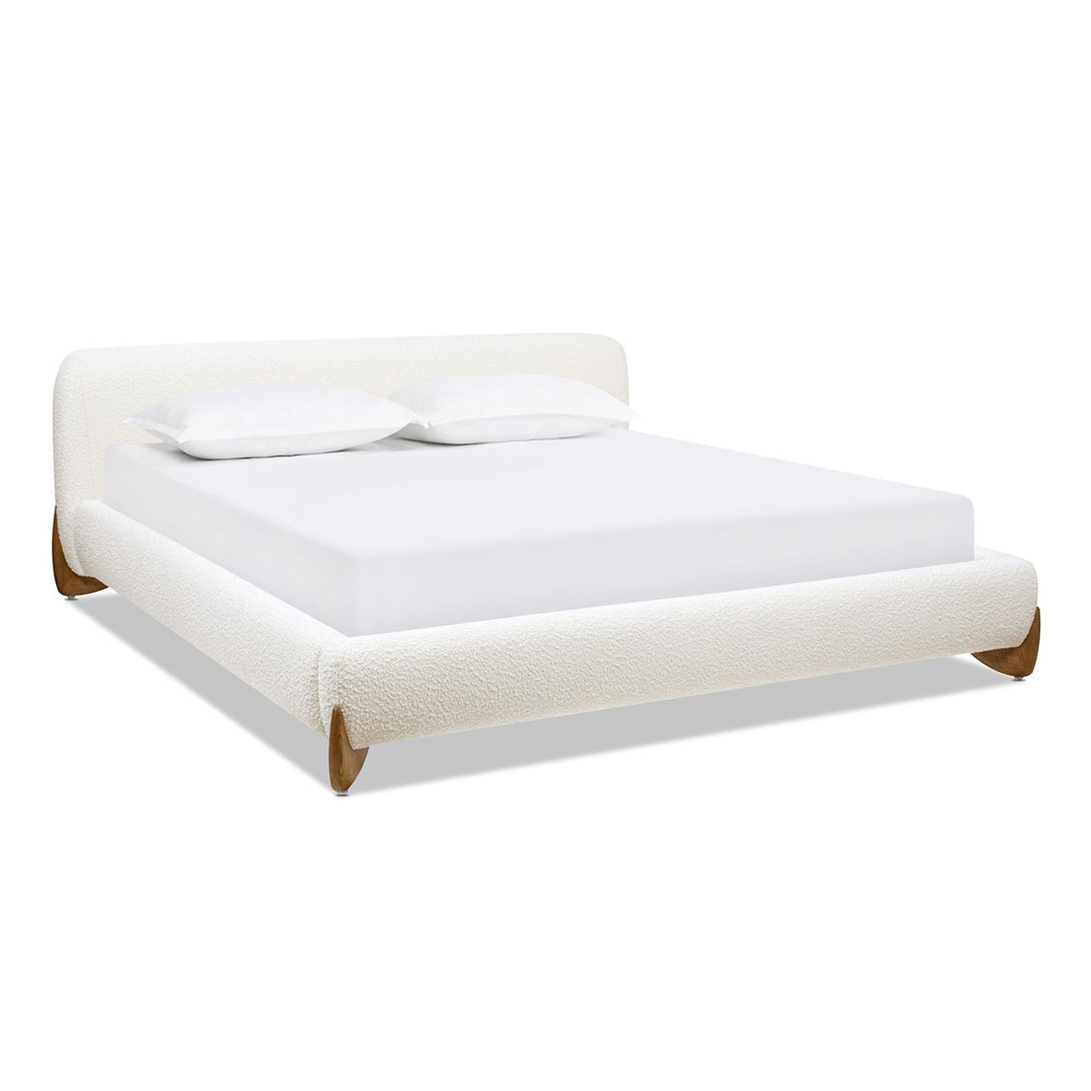 Modern platform bed in white upholstery with padded headboard and slanted wood legs