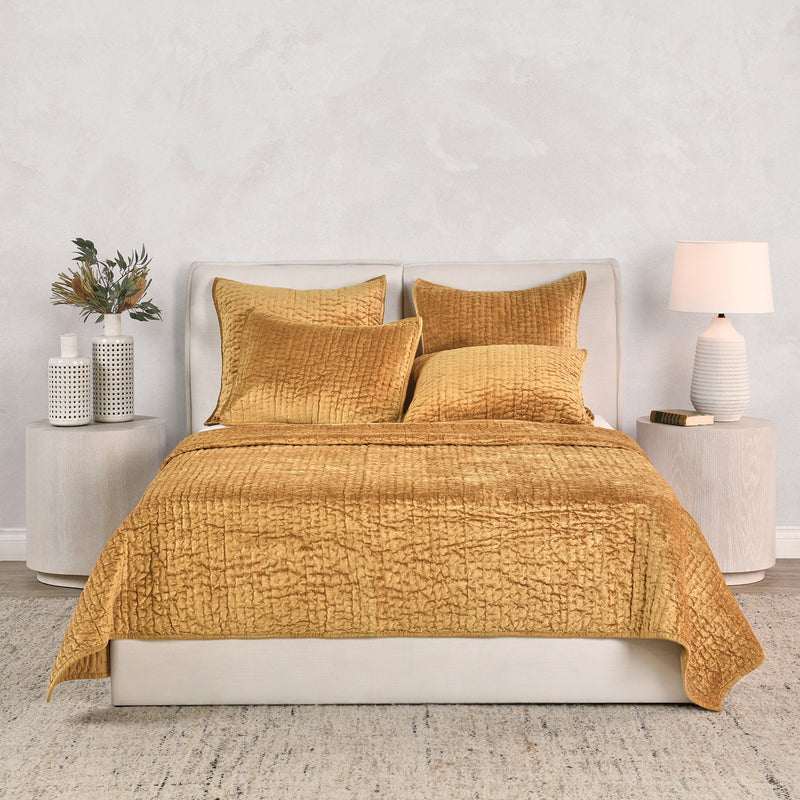 Mustard gold velvet quilt set with matching shams and decorative pillows
