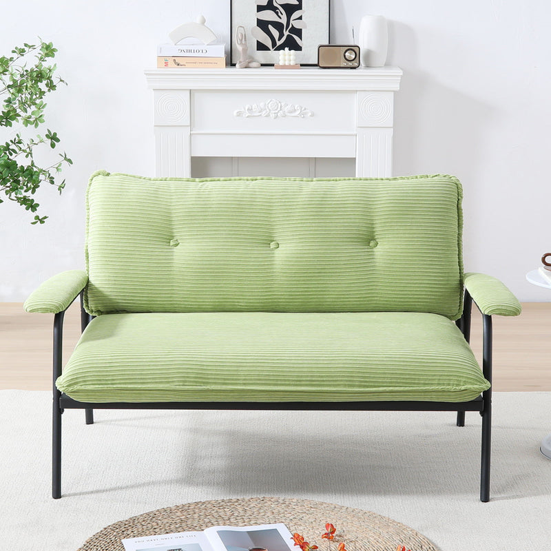 Green metal frame sofa with striped seat and padded backrest