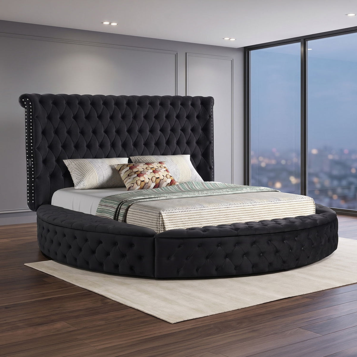Black tufted storage bed with button-tufted headboard and low curved foot