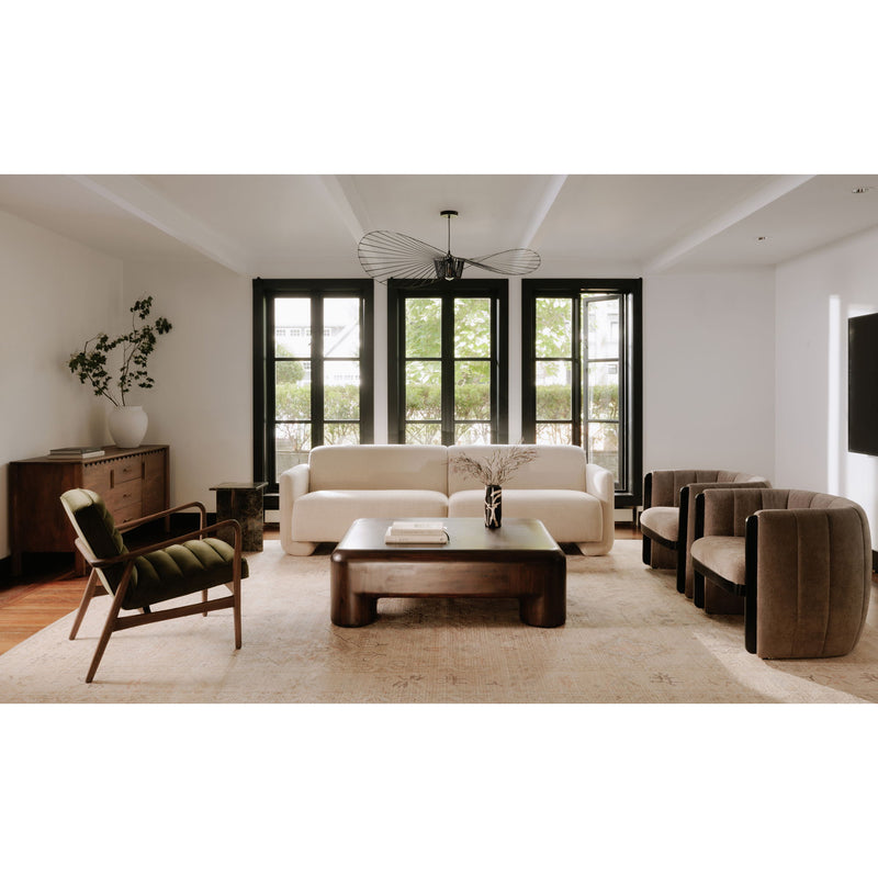 Dark brown wooden coffee table with rounded rectangular top and stout legs.