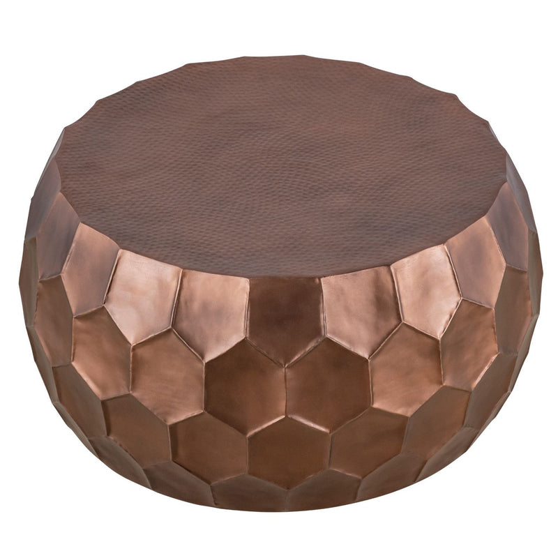Round bronze coffee table with dark textured top and raised hexagon metal panels