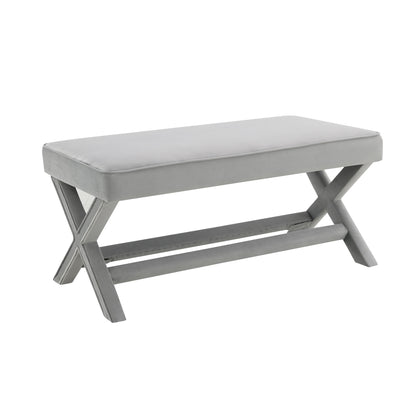 Gray upholstered double bench with crossed X-style legs and lower support shelf.