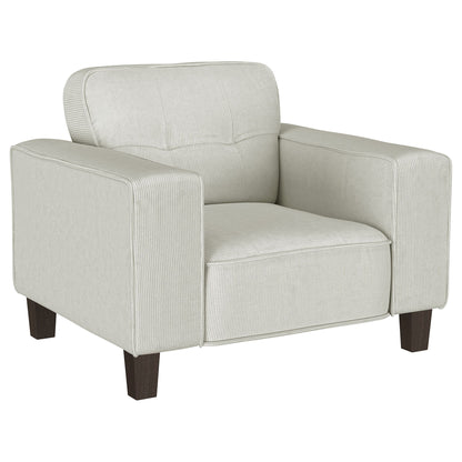 Light gray upholstered track arm accent chair with tufted back and dark wooden legs