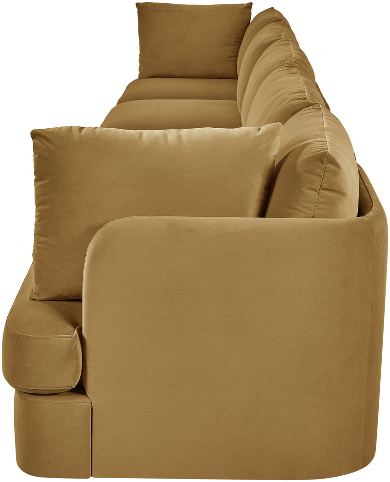 Tan velvet upholstered accent sofa chair with rounded arms and stacked back cushions