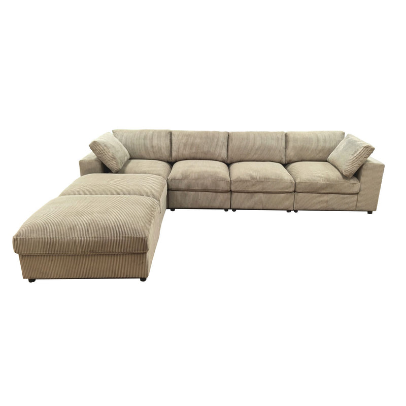 Reversible modular sectional sofa in light beige, chaise section on left with wide seats