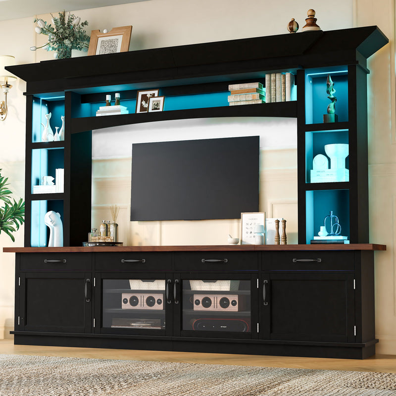Black TV stand with blue LED-lit shelves and cabinets, plus open media storage compartments
