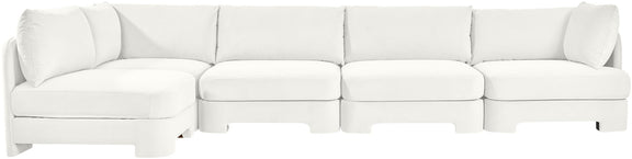 White velvet sectional sofa with chaise and segmented cushion sections