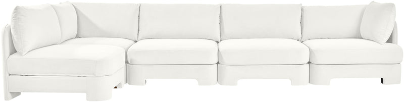 White velvet sectional sofa with chaise and segmented cushion sections