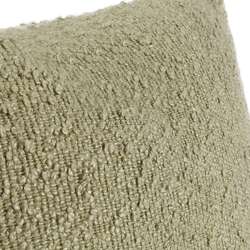 Wheat green pillow fabric close-up with textured looped weave surface