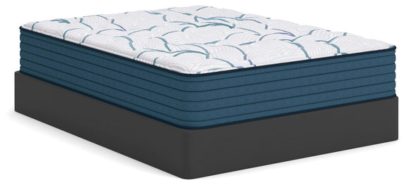 Plush mattress with white quilted top and blue base, corner view