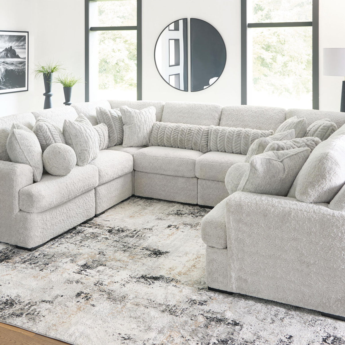 White plush sectional sofa with chaise corner, deep seats, and rounded pillow arms