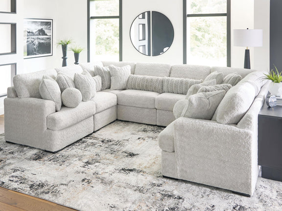 White plush sectional sofa with chaise corner, deep seats, and rounded pillow arms