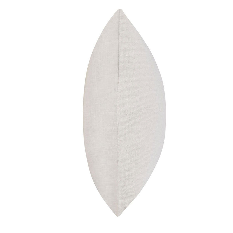 Ivory throw pillow shown from the side, solid textured fabric
