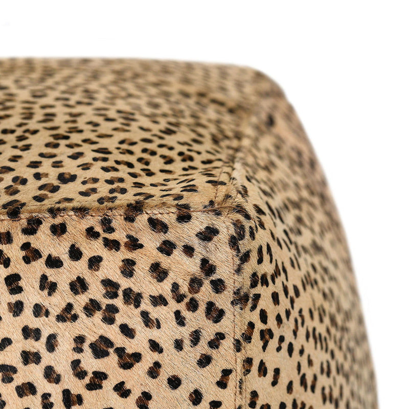 Camel leopard print hide pouf fabric close-up with speckled pattern