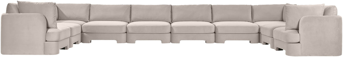 Light gray velvet sectional sofa with modular seats and corner section