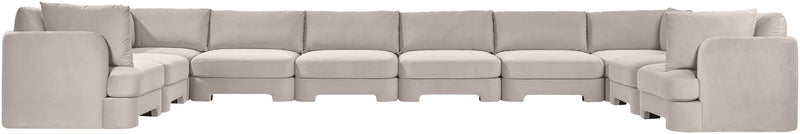 Light gray velvet sectional sofa with modular seats and corner section