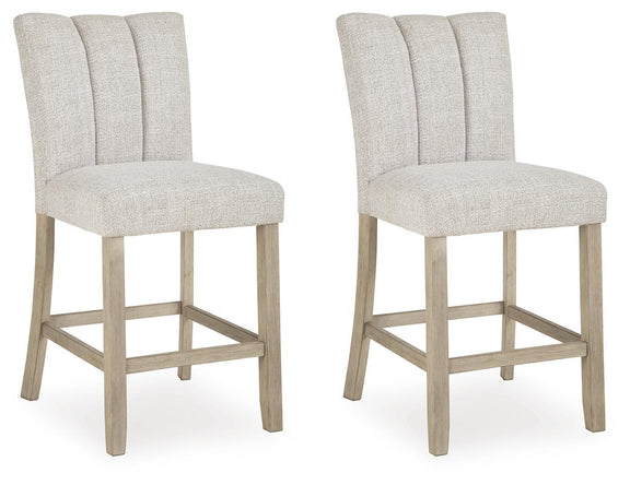 Set of two upholstered barstools in light beige with tall backs and footrests