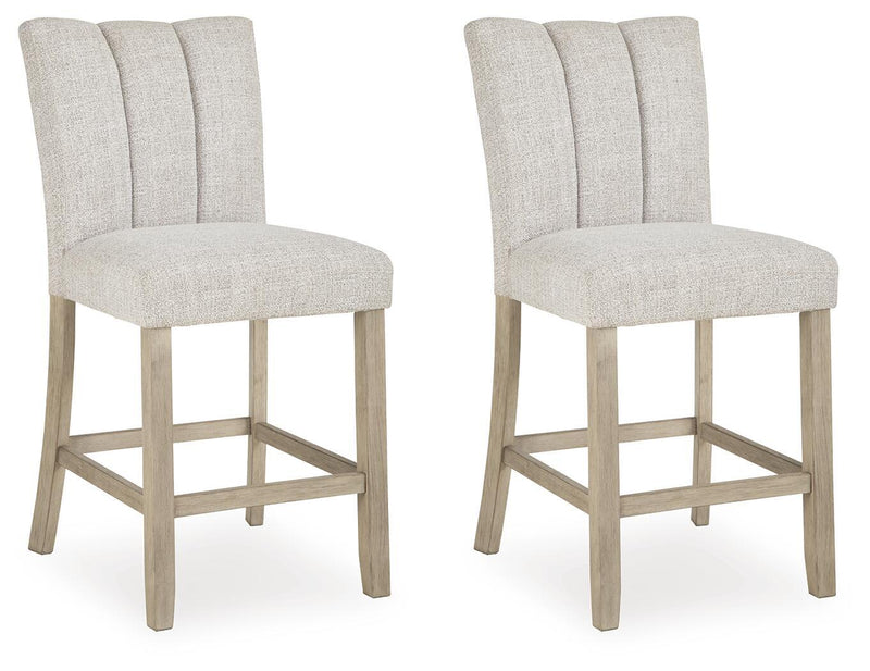 Set of two upholstered barstools in light beige with tall backs and footrests