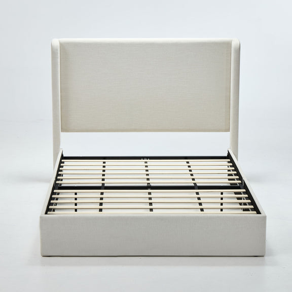 Beige upholstered wingback bed frame with tall headboard and slatted base