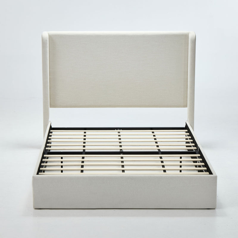 Beige upholstered wingback bed frame with tall headboard and slatted base